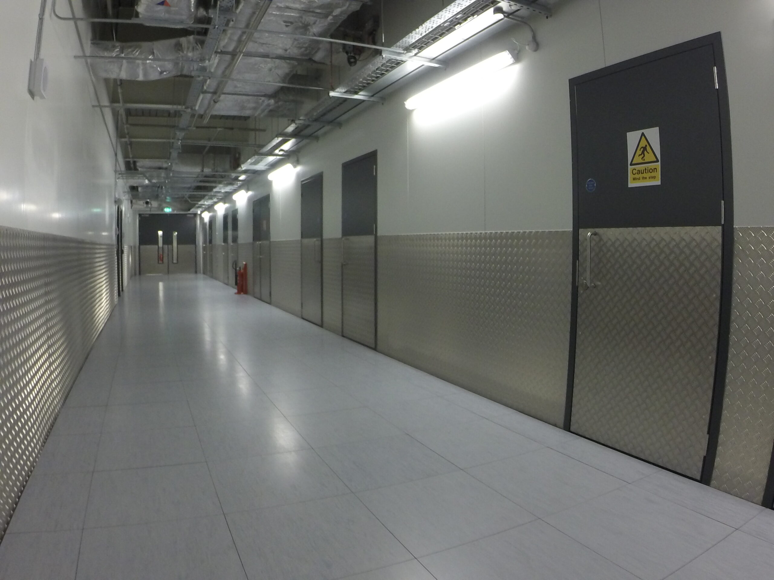 Steel door with high kick plates in a data centre