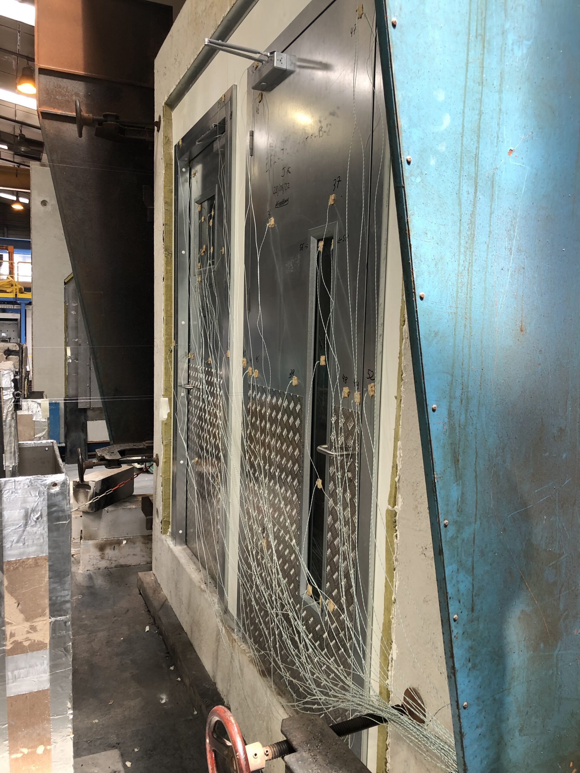 Steel door being tested with 1250mm kick plates